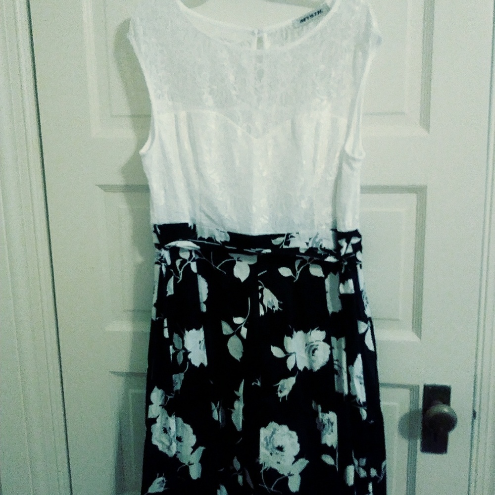 Dress with bow tie. Slip sewn inside dress.
